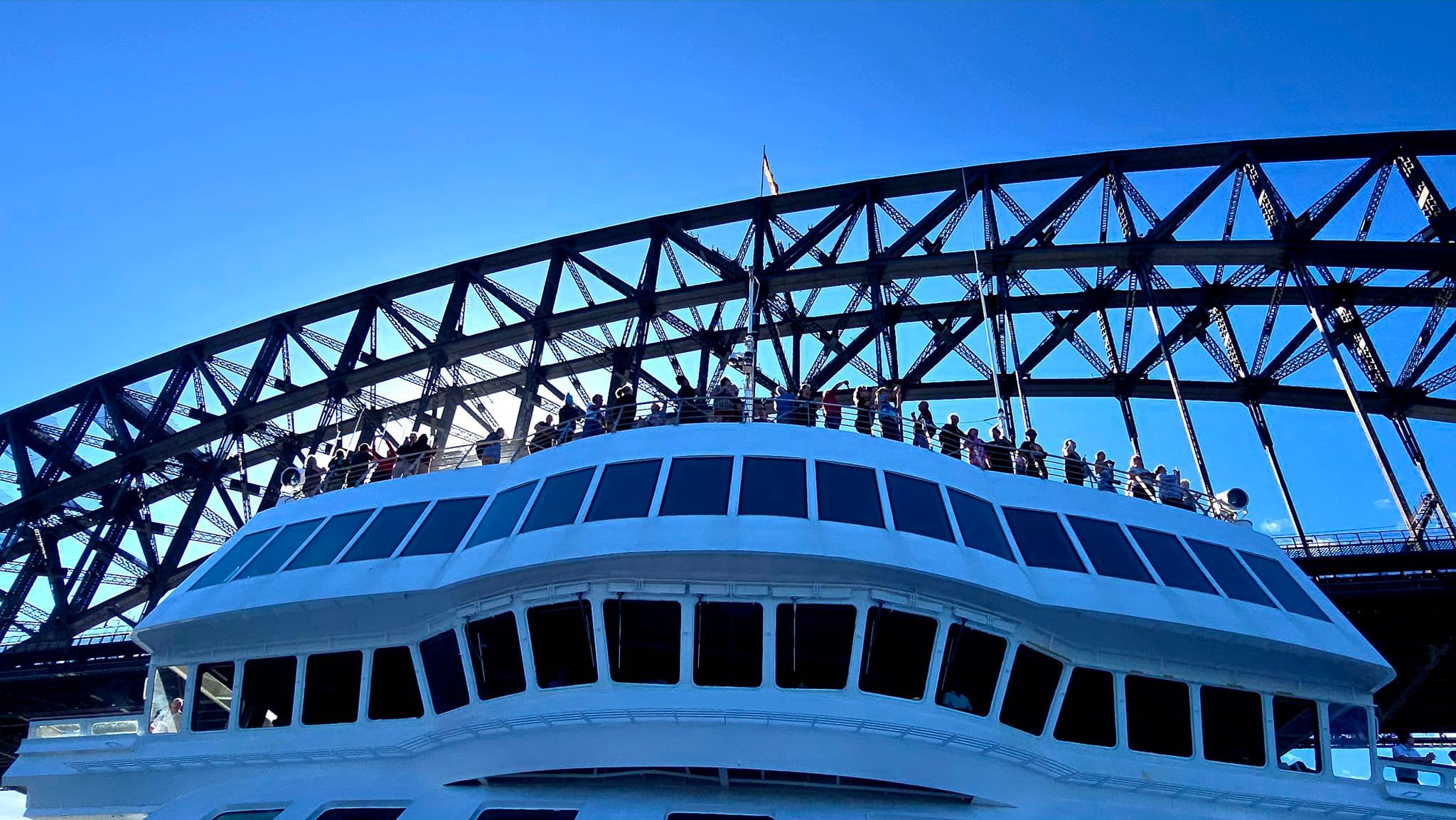 Villa Vie Odyssey sailing past Sydney Harbour Bridge
