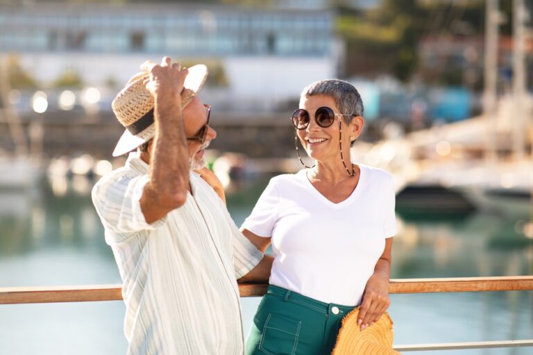 Smiling couple enjoying cruise retirement life