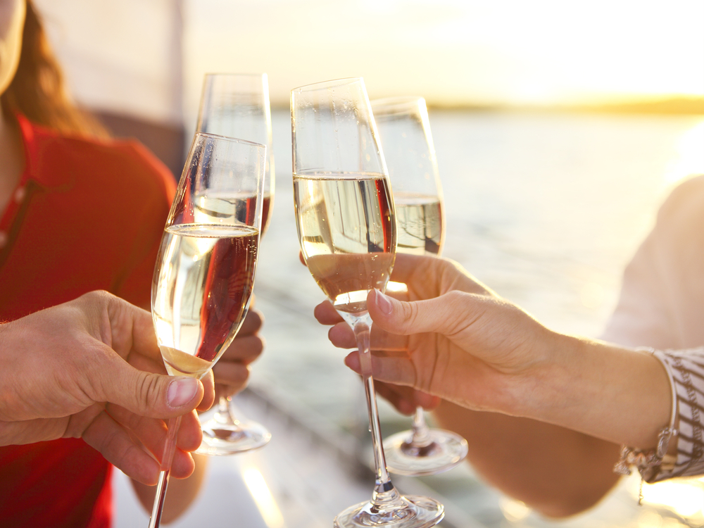 Friends toasting champagne on a cruise ship
